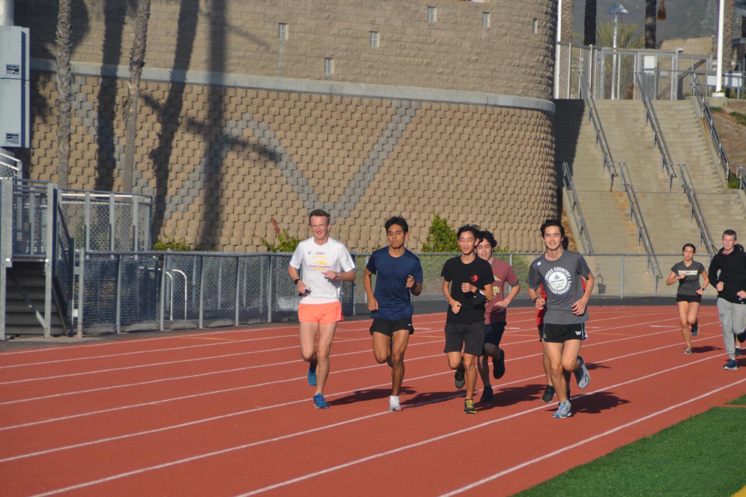 Drew Cottingham (12), Lara, Ho, and Nathan Leroy (11) lead the team around the track. Photo by Matthew Flores