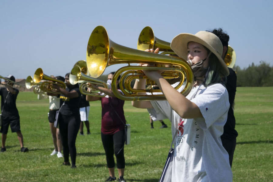 Band President Katie Jacques joins the trombone section during this practice. Other times, Jacques plays the oboe