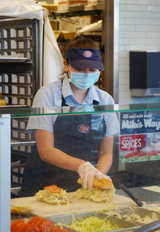 Lilah Nash (11) assembles a sandwich during her second-to-last shift, Oct. 5. After working at a sandwich shop for eight months, Nash quit to prioritize school work. Photo by Katie Lew.