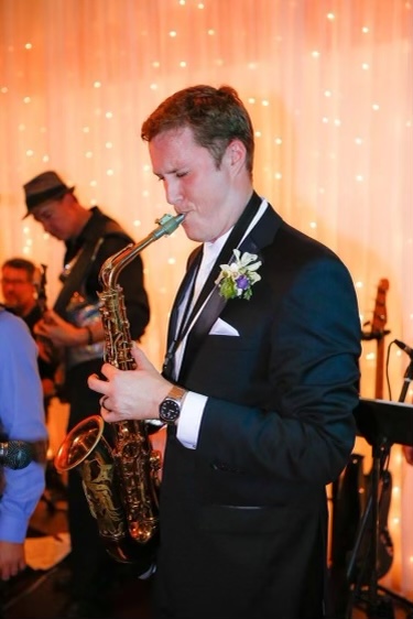 Joey Earnest plays the music he composed and recorded on the also saxophone at his wedding reception, Aug. 8,2016