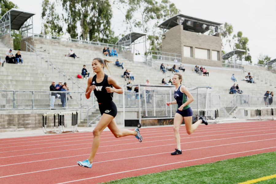 Kaitlyn Arciaga (9) runs the 800 meter during a dual track meet, March 31. After starting competitive track this year, she currently ranks 3rd nationally.