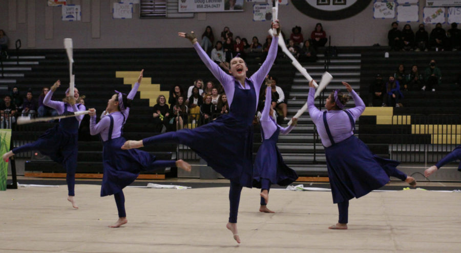 Mia Remer (11) leaps into the air with her rifle in the Winter Guards performance, “A Beginner’s Guide to Gardening,” at Westivew, April 2. Westview hosted its first Winter Guard tournament in over 15 years, where the team received second place in the Scholastic A division.