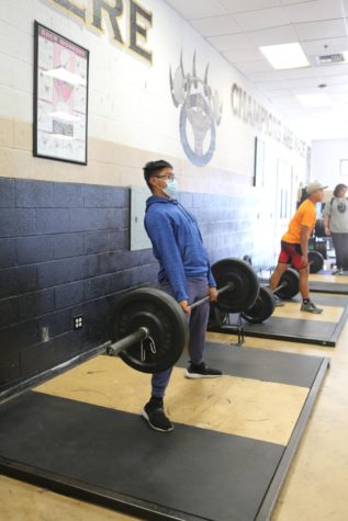William Balais (9) dead lifts during lunch in the weight room, April 27. He aspires to break the schools deadlift record.