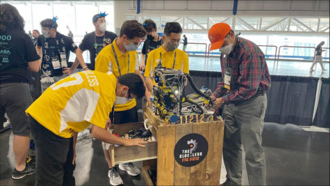 Left to right: Alex Battikha (9), Toby Sagi (12), and Hudson Kim (9) prepare The Clueless team robot for pre-match inspection, April 22. Each of the 160 robotic teams on-site for Worlds needed their robots to follow specific FTC weight and guidelines for weight and size. restrictions. 