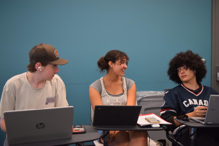 (From left to right) Sawyer Balcombe (11), Isabel Rosa (11) and Cinco Webb (11) ask one another prospective interview questions in preparation for their internship interviews. Poway to Palomar Middle College students each