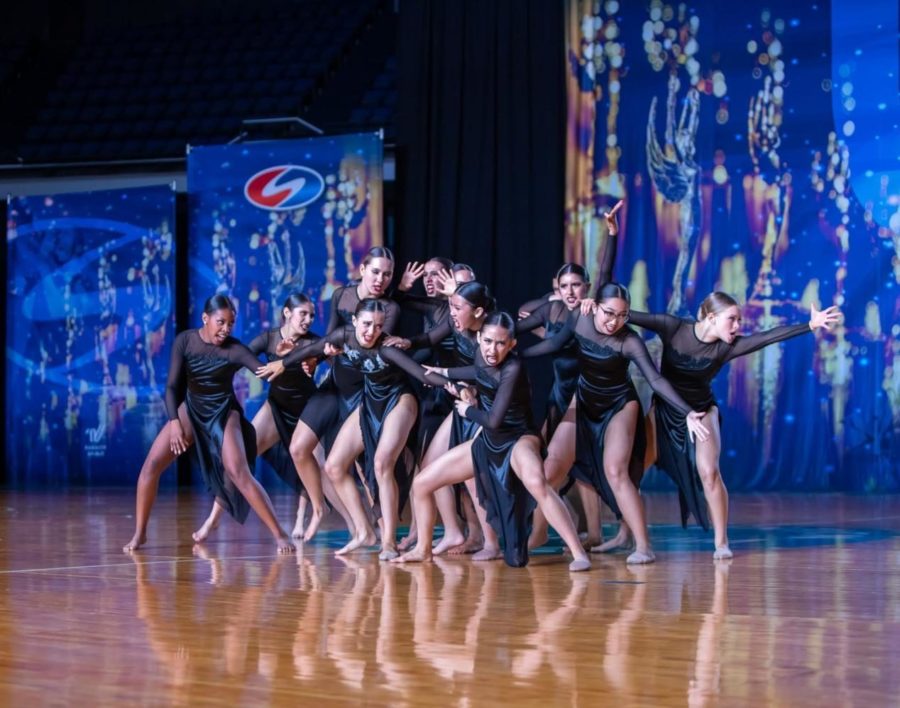Dance Troupe members performs a contemporary piece in the Medium Group division at USA Dance Nationals, March 18. They danced to Dont Let Me Go by RAIGN, a song about missing a past lover, utilizing storytelling and emotion.