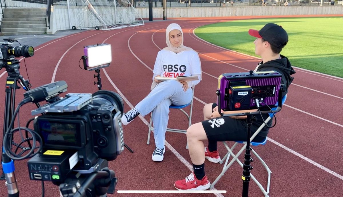 Sarah Youssef (11) interviews Deanna Walsh, the linebacker for the Boston Renegades, for a story on a professional womens tackle football team, June 22. As a part of the SRL Academy, Youssef got to work with professional journalists and equipment.
