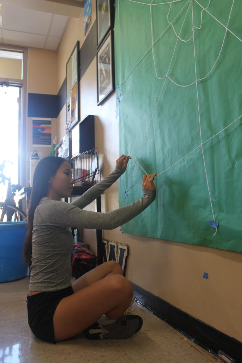Mackenzie Huynh (12) prepares for next week’s Homecoming rally, Oct. 1. ASB is preparing Spiderman-themed decorations and props for the Homecoming dance.