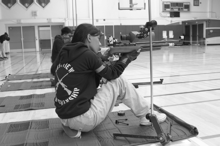 Anuja Jayasundara (11) shoots in a kneeling position during the ROTC Marksmanship Competition at Grossmont High School, Sept. 30. Jayasundara serves as the assistant captain for the A team. 