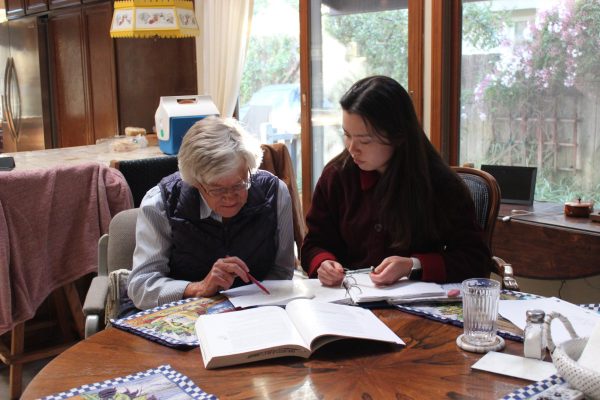 Vanessa Lee (12) reviews AP French material with her grandma, March 4. After not being able to take a French class the year prior, Lee has tried to improve her French skills.
