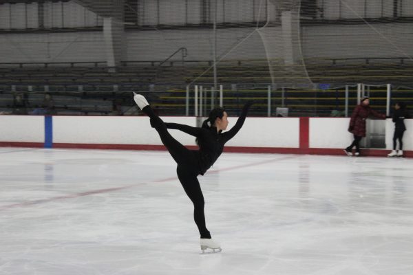 Emily Yu (12) performs a spiral at a public early morning session at the San Diego Ice Arena, May 15. Yu goes to the ice rink to practice her competition routine and technical skills for an hour and a half before school, for five days a week.