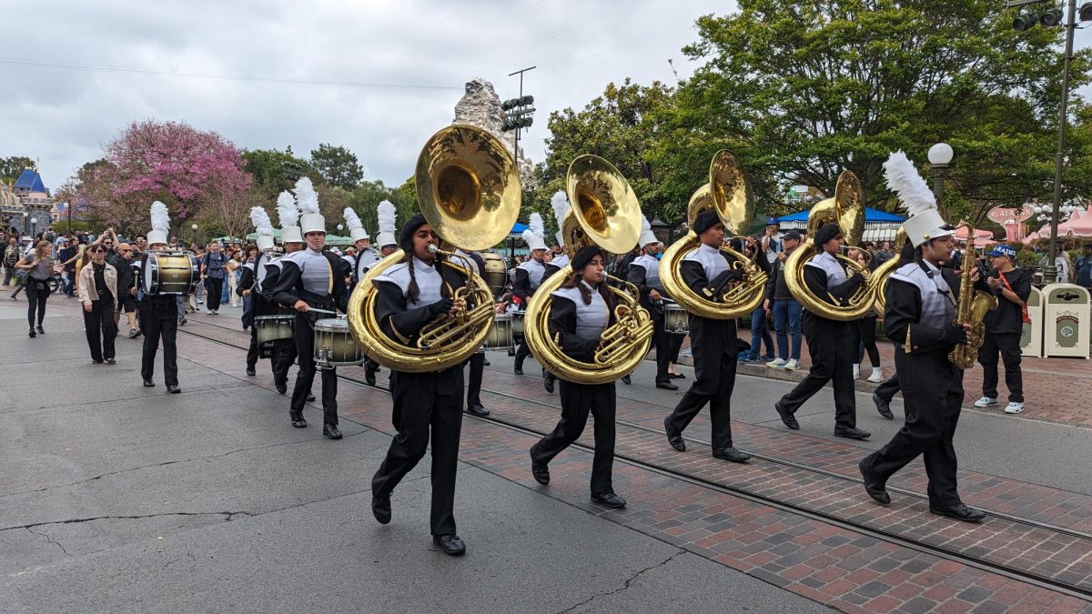 Westview GOLDs saxophones, sousaphones, and percussion march through Disneyland, May 4. This was the first time in over four years that Westview was able to participate in the Disneyland Star Wars Day parade. 