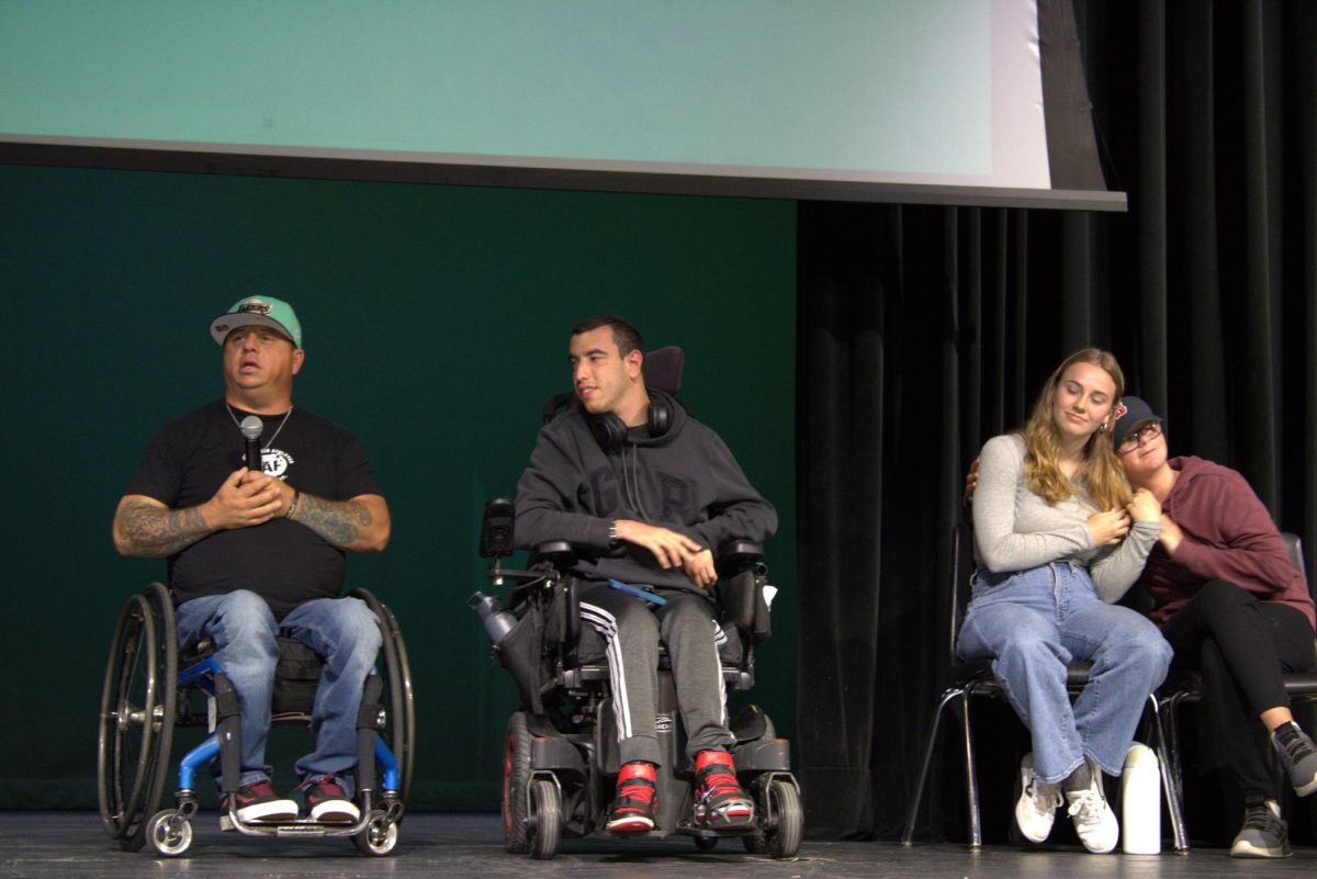 Manuel Cano, a member of the Challenged Athletes Foundation, joined by Ray Nakhle (12), Katelyn Jensen (12), and Cooper Doyle (10), answers student questions during Ability Awareness Day, April 26. The panel offered students an opportunity to gain perspective and learn about various disabilities. 