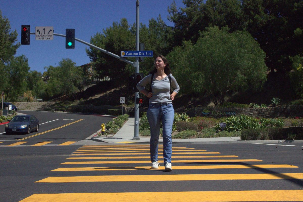 Julia Smith (12) walks towards her carpool after PUSD limited the number of buses and bus routes around Westview. The PUSD  Transportation Department had to reduce this service after the district experienced budget cuts and was not able to pay drivers. Many students have been left without rides due to these circumstances and have had to arrange alternative methods.