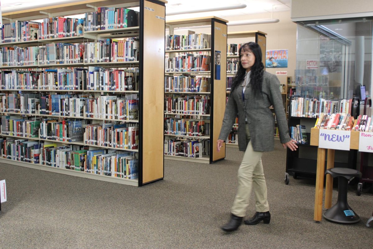 Luz Okiawa walks between Mesa Verde and Westview's library, Sept. 17. By working at both schools, she helps connect both communities. 