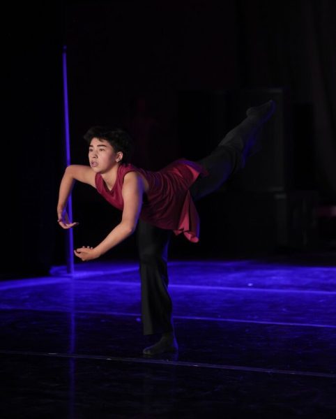 Grayson Skarsvaag (11) holds an arabesque in his contemporary solo at the NUVO Dance Convention, Nov. 2. He scored a perfect 300 points in the senior division, placing him first.