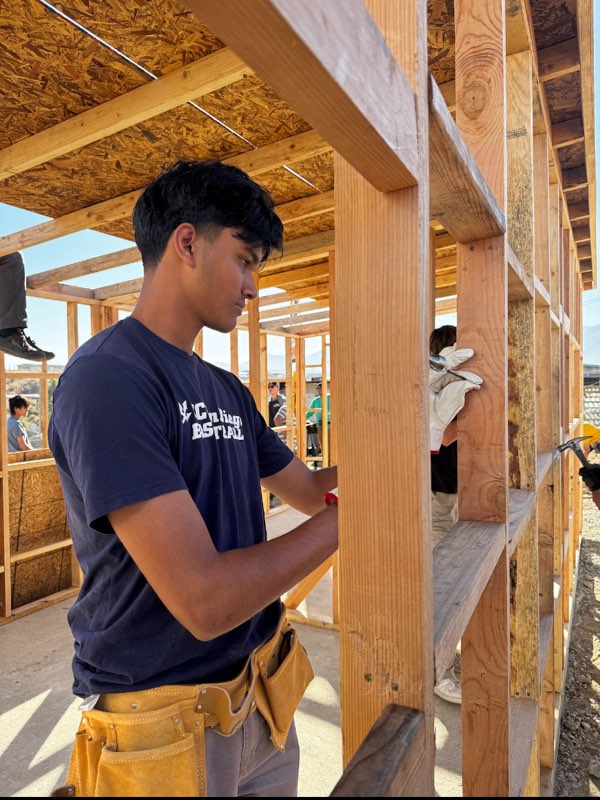 Joel Jacob (11) hammers a nail into a wooden framework, Nov. 9. Jacob helped build a home for a family of five in Mexico. 

Photo Courtesy of Joel Jacob