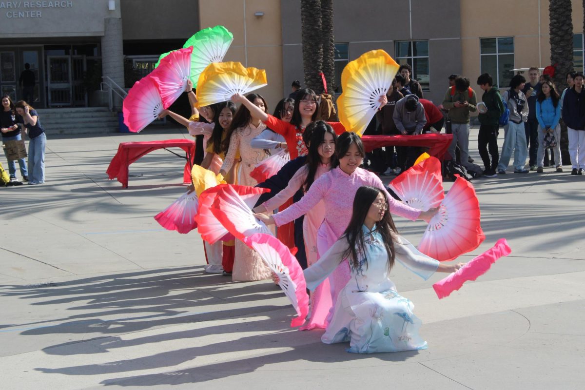 Vietnamese Student Association (VSA) members perform at Westview's Lunar New Year event in the plaza, Jan. 28. The dance is called Vu Phien and features brightly colored fans. 