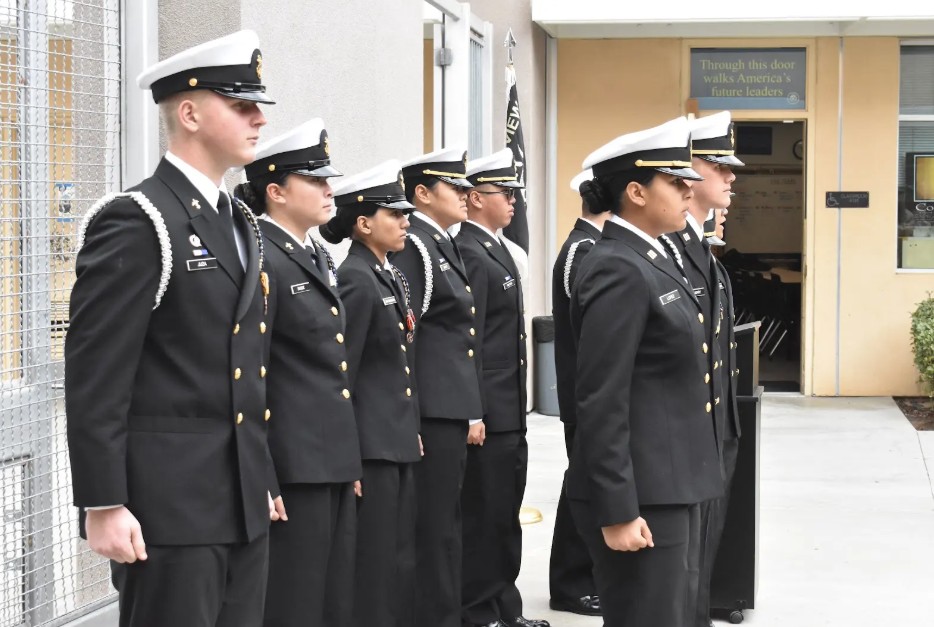 [Left to right] Matteus Juza (11), Emerson Budde (12), Anuja Jayasundara (12), Michele Nuguid (12), Cory Nguyen (12), Maya Lopez (12), and Pierce McMurry (12) line up for the change of command ceremony outside the NJROTC classroom, Jan. 30. The program currently has 50 members.