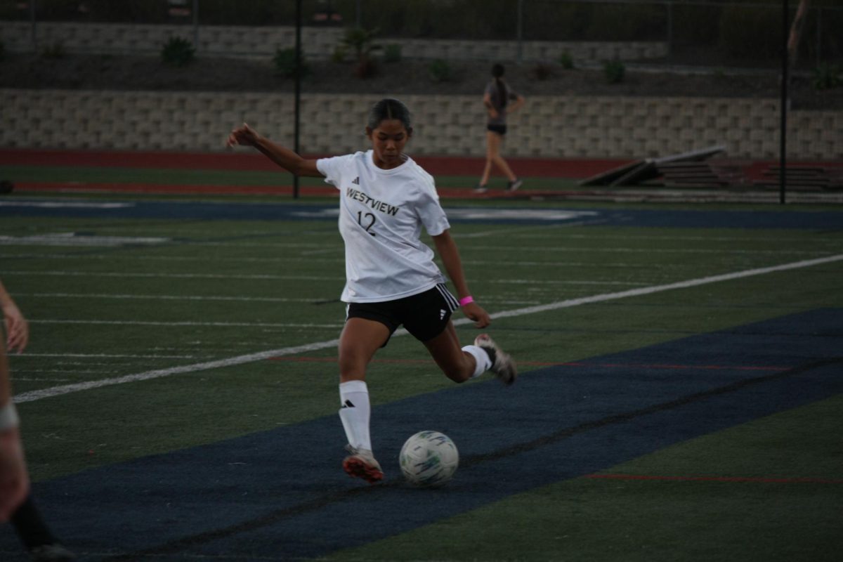 Ally Damron (9) readies to pass the ball in the Open Division semifinal game against San Marcos, Feb. 26. They lost 2-1.