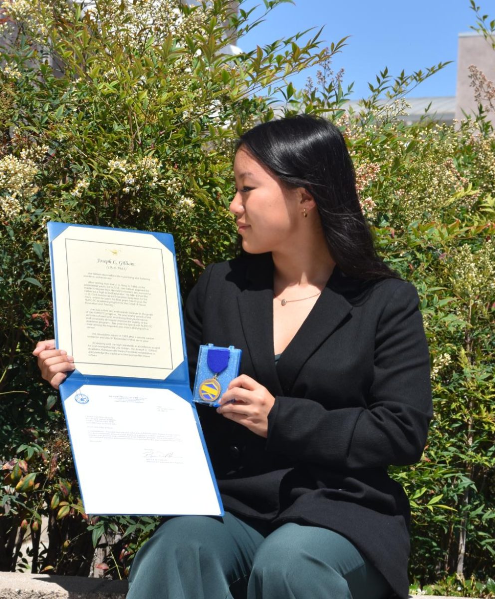 Allison Hauw looks at the Joseph C. Gillian Academic Award, May 7. she is the current Commanding Officer and has been in NJROTC for four years, 