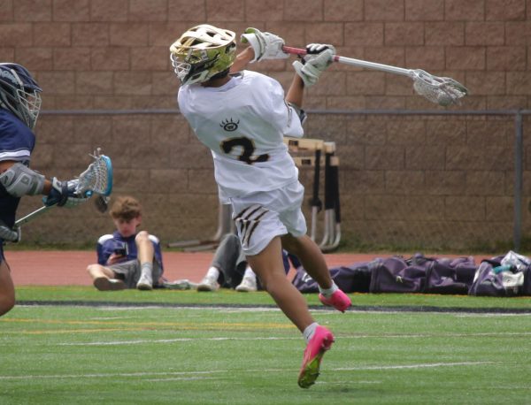 Noa Magbanua (11) shoots the ball against SDA during CIF championships, May 17. The Wolverines kept within on point throughout the first half but later fell behind.