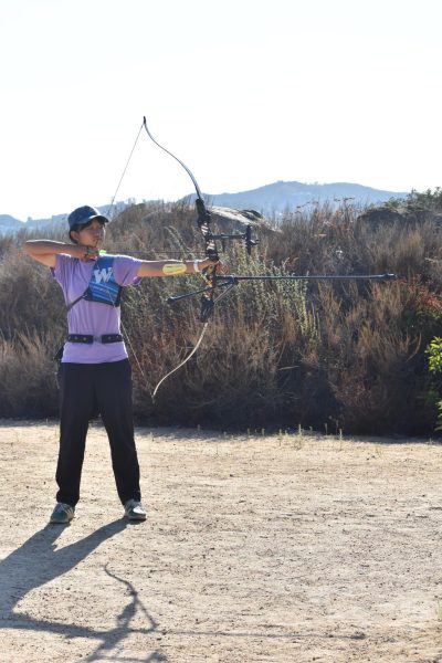 Seyoon Park (9) pulls her bowstring, aiming at a target during practice, Sept. 12. She currently holds third place in the country in U15 women with recurve bows, earning her a spot on Team USA.
