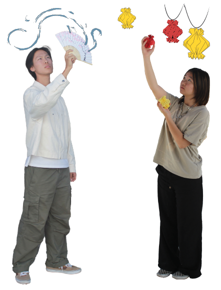 Jonathan Rhee (12) holds a Korean buchae, Oct. 7. These fans are used in traditional Buchaechum dances. Sunny Park (12) demonstrates hanging paper lanterns, Oct. 7. In China, red paper lanterns symbolize good fortune and family unity.