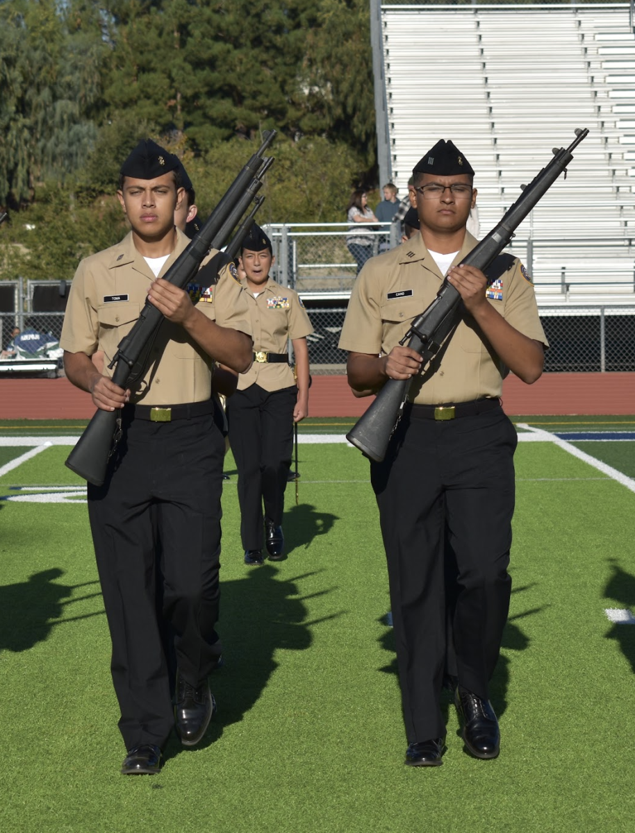 Gabriel Toma (11) and Leo Cano (12) [left to right] march for Armed Regulation, Nov. 1. NJROTC competed against 17 different schools.