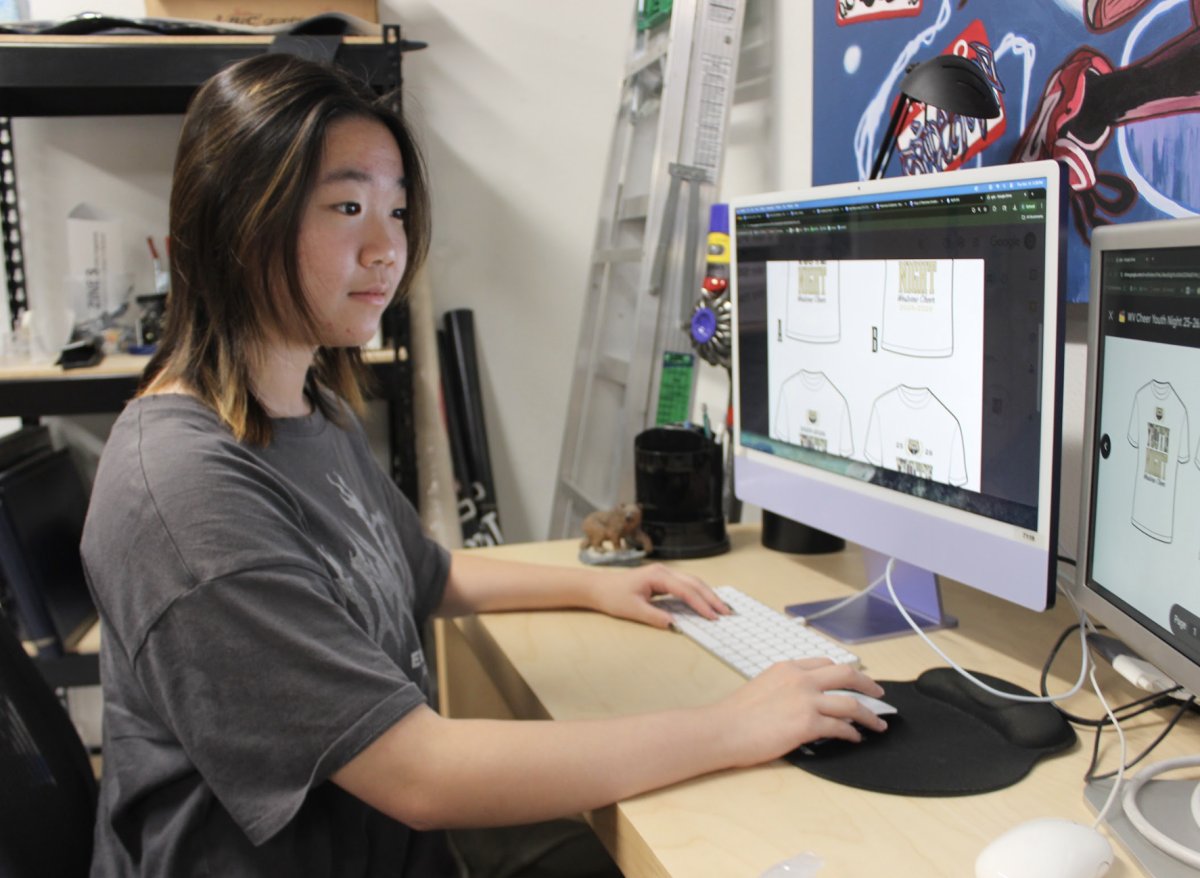 Sunny Park (12), co-president of Westview Graphic Design Studio (GDS), designs t-shirts for the Cheer Youth Night, Nov. 13. They regularly take PUSD commissions.