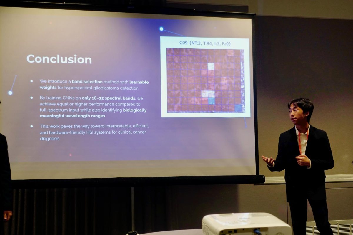 Albert Li (12) presents his data mining research at a DC conference, Nov. 15. His project focused on distinguishing cancer cells with hyperspectral imaging.