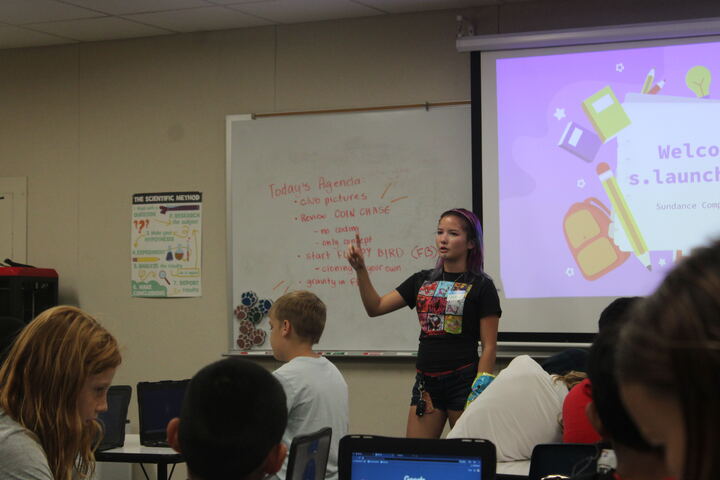 Jade Peters (12) reviews the day's agenda with students at Sundance Elementary, Nov. 12. Peter introduced her organization in 2024 after her favorite childhood coding program was canceled.
Courtesy of Vacious Cadena