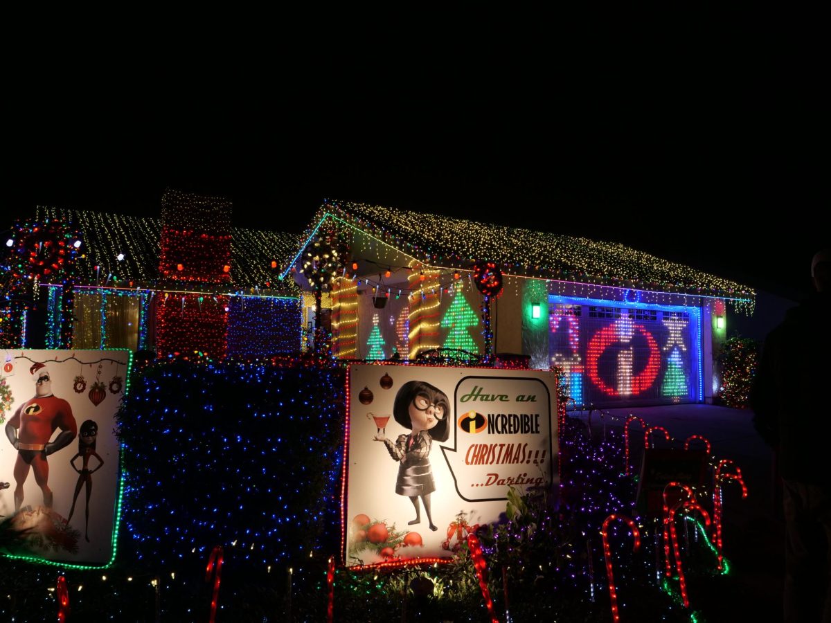 Bryan and Lexi Adamson's Incredibles-themed decorations stnad out on Christmas Card Lane. The house is covered by about 80,000 lights.