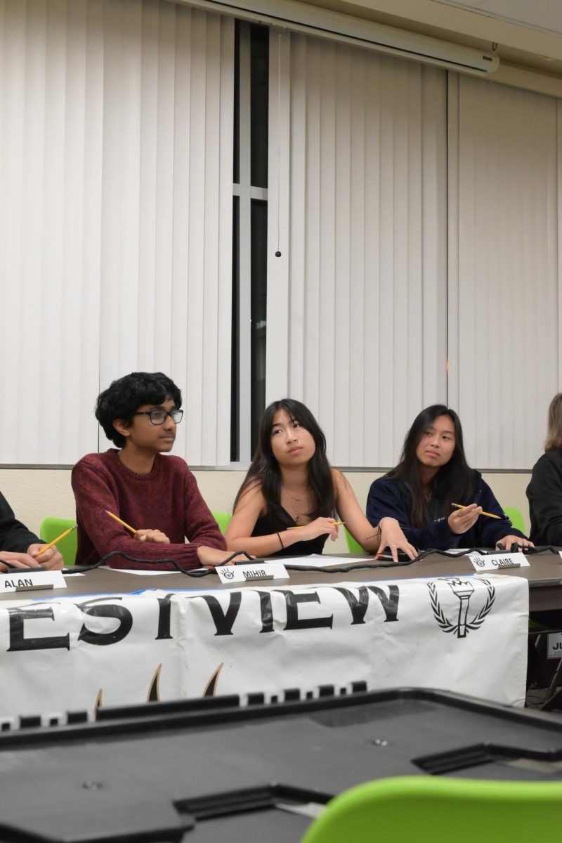 Mihir Konkapaka (10), Claire Bui (10), and Kristi Le (10) [left to right] prepare for their next round of questions, Feb. 5. Westview won 3-0 for all divisions against Poway High School.