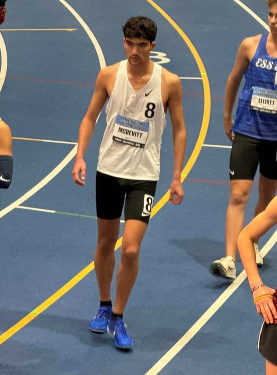 Parker McDevitt (12) walks off the track after finishing his 5k event at the Nike Indoor Nationals, March 12. He placed third out of 14.